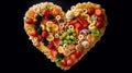 Heart made of healthy foods on black background