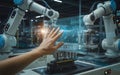 Human hand interacting with advanced robotic arms in a futuristic manufacturing setting Royalty Free Stock Photo