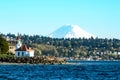 Alki Lighthouse in the shadow of Mount Rainier on Puget Sound Royalty Free Stock Photo