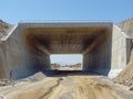 Modern Concrete Tunnel Through Desert Terrain Royalty Free Stock Photo