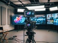 Modern film studio with advanced camera setup and multiple screens Royalty Free Stock Photo