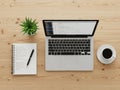 Modern workspace setup with laptop and notebook Royalty Free Stock Photo
