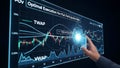 Oil A person interacting with a digital screen displaying a financial graph and data analysis Royalty Free Stock Photo