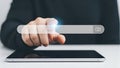 A person interacting with a search bar on a tablet screen with a glowing effect Royalty Free Stock Photo