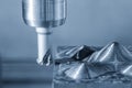Rough Cutting Mold Parts on CNC Milling Machine Using Indexable Tool in Blue Tone Industrial Scene Royalty Free Stock Photo