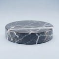 A round marble object with white veins on a plain background Royalty Free Stock Photo