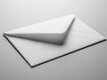 Single white envelope on plain surface Royalty Free Stock Photo