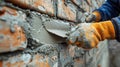 Skilled Bricklayer Installing Masonry on Exterior Wall with Trowel and Putty Knife Royalty Free Stock Photo