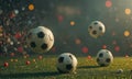Three soccer balls in mid-air, with one slightly higher than the other, against backdrop blurred stadium and Royalty Free Stock Photo