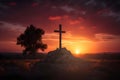 Solitary Cross Standing Against a Vibrant Sunset Sky