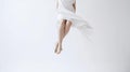 Woman\'s legs floating in air wearing white dress Royalty Free Stock Photo