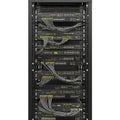 High-density server rack with numerous networking and cabling connections Royalty Free Stock Photo