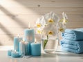Serene indoor setting with white orchids and blue candles Royalty Free Stock Photo