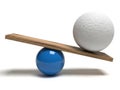 Balanced spheres on a wooden plank demonstrating equilibrium in physics. isolated on white background Royalty Free Stock Photo