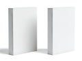 Two white rectangular objects standing upright on a plain surface Royalty Free Stock Photo