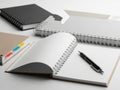 Organized workspace with notebooks and pen isolated on white background Royalty Free Stock Photo