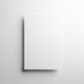 A white rectangular object casting a shadow on a plain white background. isolated on white background Royalty Free Stock Photo