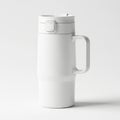 A white travel mug with a handle and lid Royalty Free Stock Photo