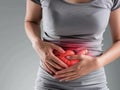 Inflammation of the intestines: a woman holds her inflamed stomach Royalty Free Stock Photo