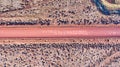 Desert plains aerial looking down at dirt road