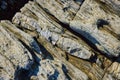 Detail of rocks from above with large section of mineral quartz vein