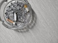 Image of a dirty ashtray because cigarette butts and ashes