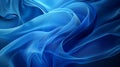 Blue satin fabric smooth waves luxurious dynamic abstract background Royalty Free Stock Photo