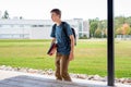 Happy teenager studying outdoors at a picnic table. Royalty Free Stock Photo