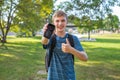 Happy teenager showing blank screen of cellphone. Royalty Free Stock Photo