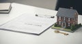 home loan application with miniature house and key Royalty Free Stock Photo