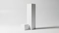 Minimalist geometric shapes composed of a tall rectangular prism and smaller cube Royalty Free Stock Photo