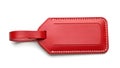 A sleek red leather luggage tag attached by a sturdy red strap Royalty Free Stock Photo