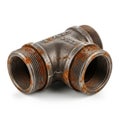 A close-up view of a rusty three-way pipe fitting with threaded ends Royalty Free Stock Photo