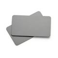 Two gray rectangular objects with a textured surface placed on top of each other Royalty Free Stock Photo