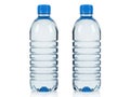 Two clear plastic bottles with blue caps standing side by side on a white background Royalty Free Stock Photo