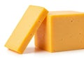 Two blocks of aged cheddar cheese resting on a plain background. isolated on white background Royalty Free Stock Photo