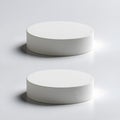 Two clean white cylindrical objects placed side by side on a smooth neutral surface for modern design and minimalist composition Royalty Free Stock Photo