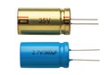 Two different types of electronic capacitors shown side by side for comparison Royalty Free Stock Photo
