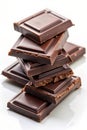 Vertical Stack of Dark Chocolate Bar Segments Against a White Background pieces Royalty Free Stock Photo