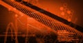 Image of dna strand spinning and data processing on orange background Royalty Free Stock Photo