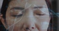 Image of dna strands and medical data over closed eyes of female asian doctor