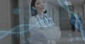 Image of dna strands over asian female doctor