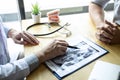 Image of doctor or dentist presenting with tooth x-ray film recommend patient in the treatment of dental and dentistry, working at Royalty Free Stock Photo