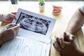 Image of doctor or dentist presenting with tooth x-ray film recommend patient in the treatment of dental and dentistry, working at Royalty Free Stock Photo