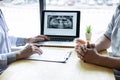 Image of doctor or dentist presenting with tooth x-ray film recommend patient in the treatment of dental and dentistry, working at Royalty Free Stock Photo