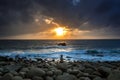 Nature Seascape with Zen Stacked Rocks on Beach in Little Sunshine at Dawn