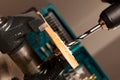 Image of drilling hole in wood clamped in vice tool. Royalty Free Stock Photo