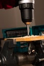 Image of drilling hole in wood clamped in vice tool. Royalty Free Stock Photo