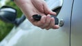 Image with a Driver Opening Car Door with Car Key Royalty Free Stock Photo