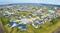 Drone aerial of Midwest American suburban neighborhood houses with ponds and housing addition and cul-de-sac